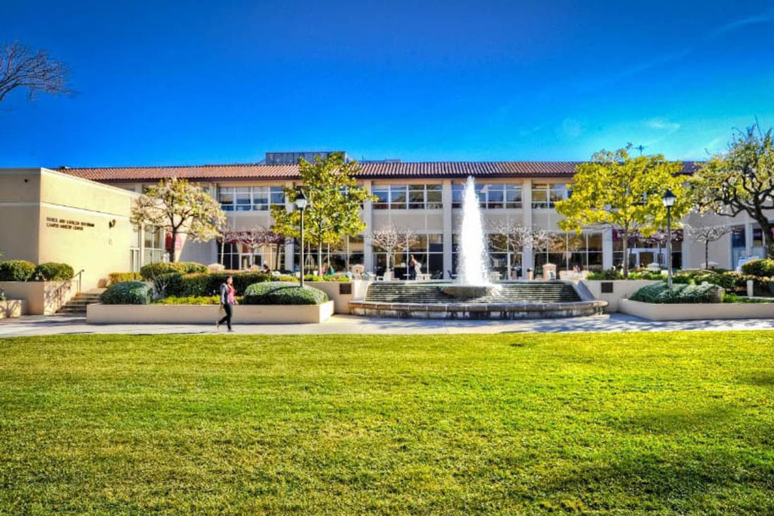 Campus building with fountain and lawn at Santa Clara University